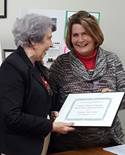 Mooly Thompson presents certificate to Virginia Gills
